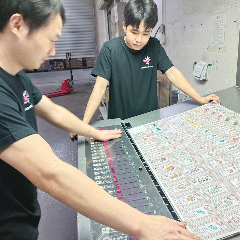 Technical team debugging printing machines for color accuracy
