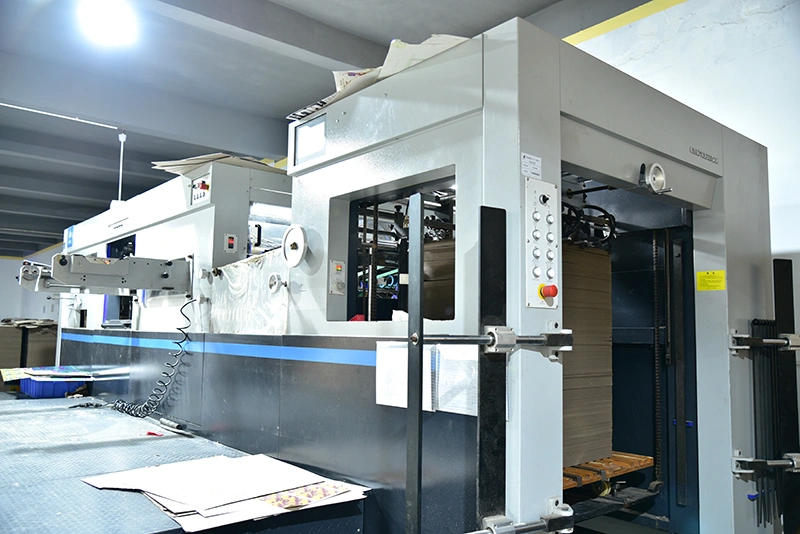 Precision die cutting machine for custom game tokens and tiles