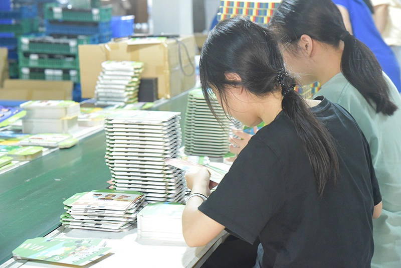 Systematic board game assembly workshop with 560 skilled workers