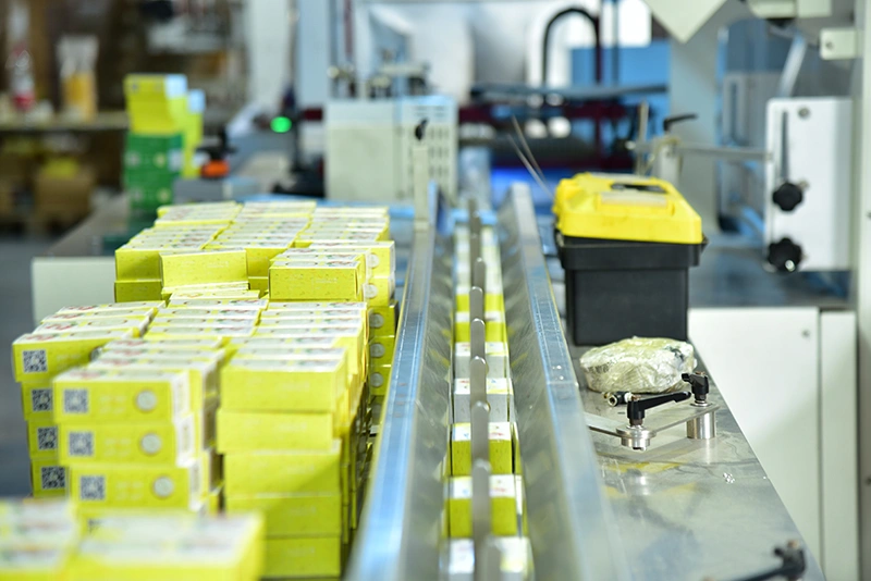 Automated card production and packaging line for custom card games